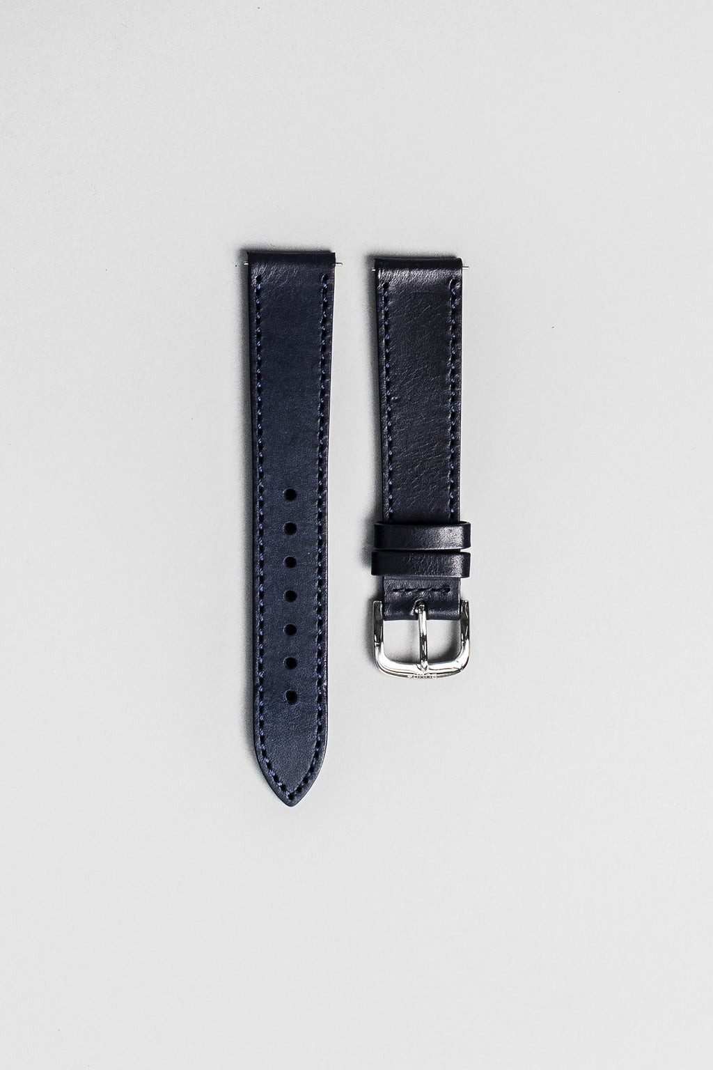 The blue veg tan Italian leather strap with polished buckle. 18mm
