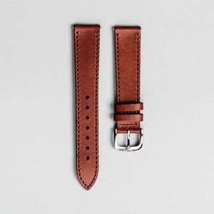 The brown Italian veg tan leather strap with polished buckle. 18mm