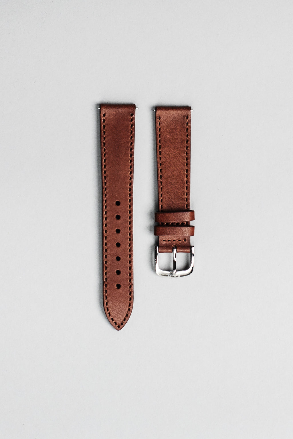 The brown Italian veg tan leather strap with polished buckle. 18mm